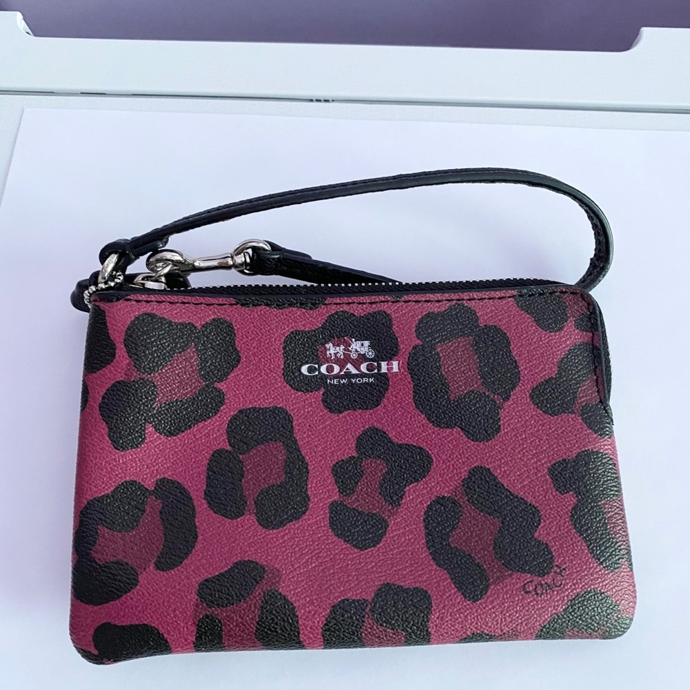 Coach pink cow print wristlet